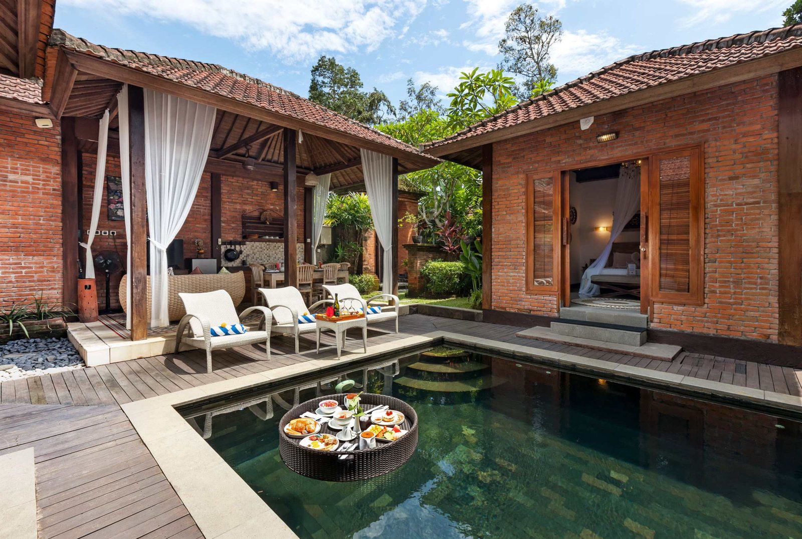 A floating breakfast tray in the private pool of a villa at Ubud Raya Resort